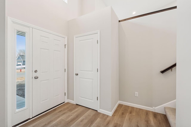 224 9th Ave Ct NW, Lonsdale, MN 55046 - foyer with baseboards, stairs, and light wood finished floors