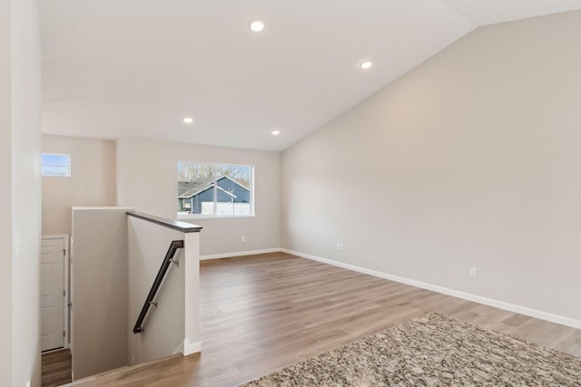 224 9th Ave Ct NW, Lonsdale, MN 55046 - unfurnished room featuring vaulted ceiling, light wood-style flooring, recessed lighting, and baseboards