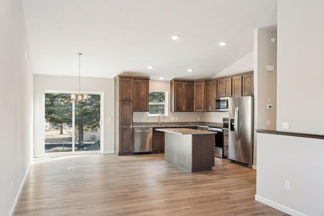 224 9th Ave Ct NW, Lonsdale, MN 55046 - kitchen with light wood-type flooring, a center island, recessed lighting, stainless steel appliances, and a chandelier