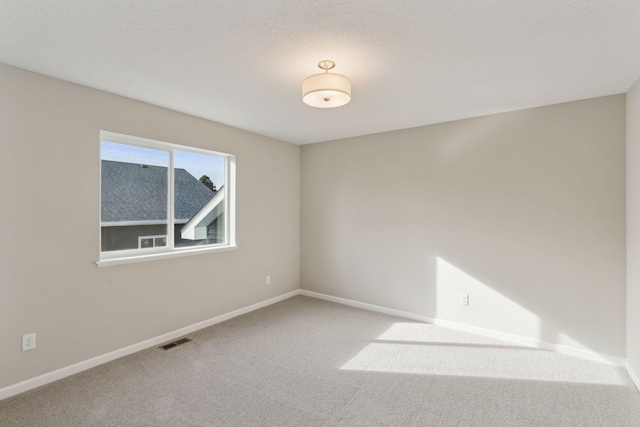 224 9th Ave Ct NW, Lonsdale, MN 55046 - unfurnished room with visible vents, baseboards, and carpet
