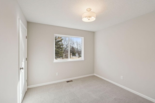 224 9th Ave Ct NW, Lonsdale, MN 55046 - carpeted empty room featuring visible vents, baseboards, and a textured ceiling