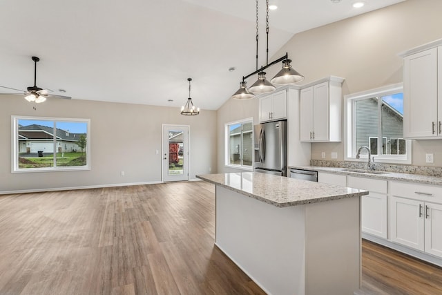 4905 Evergreen Dr N, Hugo, MN 55038 - kitchen featuring stainless steel appliances, open floor plan, plenty of natural light, recessed lighting, and high vaulted ceiling