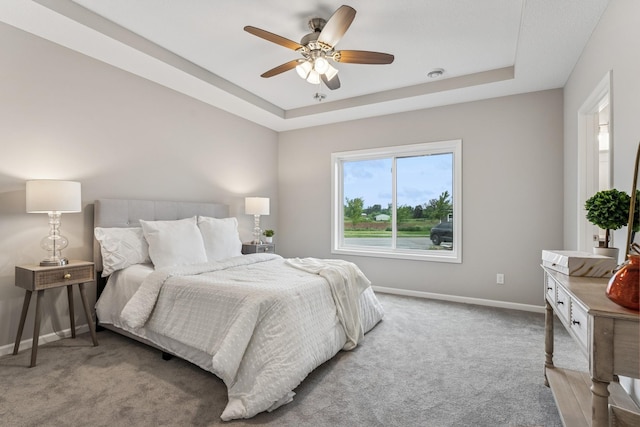 4905 Evergreen Dr N, Hugo, MN 55038 - bedroom featuring carpet flooring, a tray ceiling, and ceiling fan
