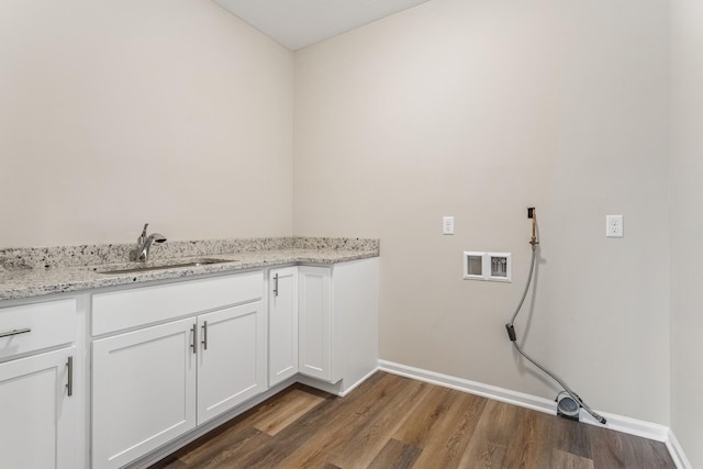 4905 Evergreen Dr N, Hugo, MN 55038 - laundry room with dark wood-style flooring and cabinet space