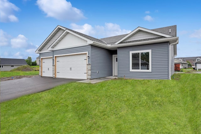 4905 Evergreen Dr N, Hugo, MN 55038 - single story home featuring a garage, asphalt driveway, a front yard, and a shingled roof