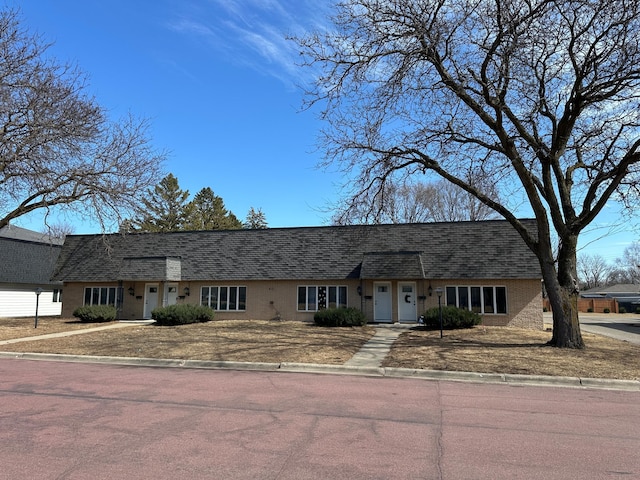 412 Holly Ln, Mankato, MN 56001 - view of front of house featuring brick siding and roof with shingles