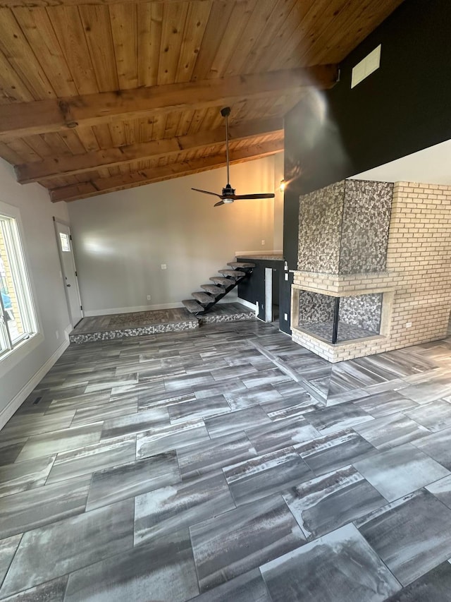 412 Holly Ln, Mankato, MN 56001 - interior space featuring a brick fireplace, baseboards, wood ceiling, lofted ceiling with beams, and a ceiling fan