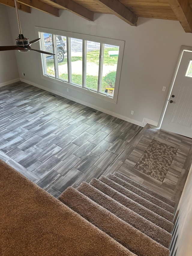 412 Holly Ln, Mankato, MN 56001 - unfurnished living room with wood finished floors, baseboards, beam ceiling, and ceiling fan