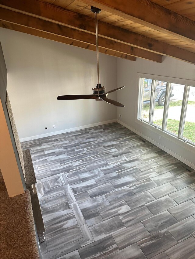 412 Holly Ln, Mankato, MN 56001 - unfurnished room featuring wood ceiling, beamed ceiling, a ceiling fan, and baseboards