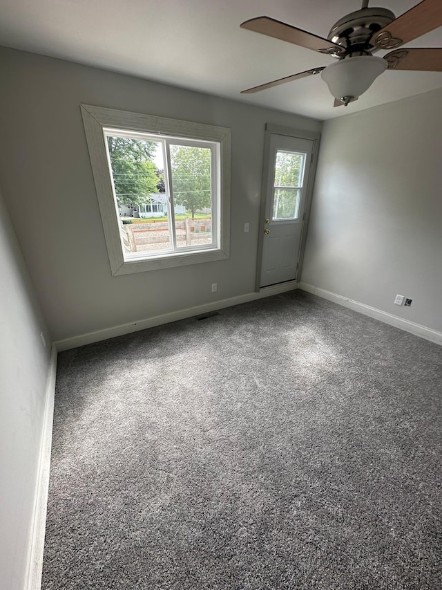 412 Holly Ln, Mankato, MN 56001 - empty room with a ceiling fan and baseboards