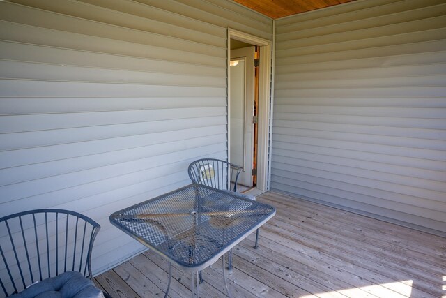 1102 Summit Cv, Dassel, MN 55325 - wooden deck with outdoor dining space
