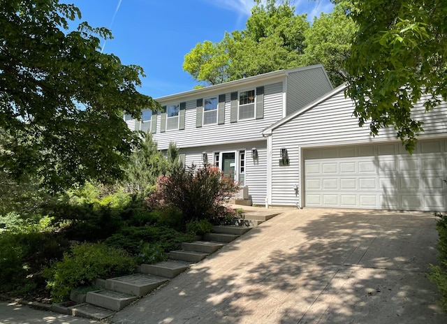 view of front of house with an attached garage and concrete driveway