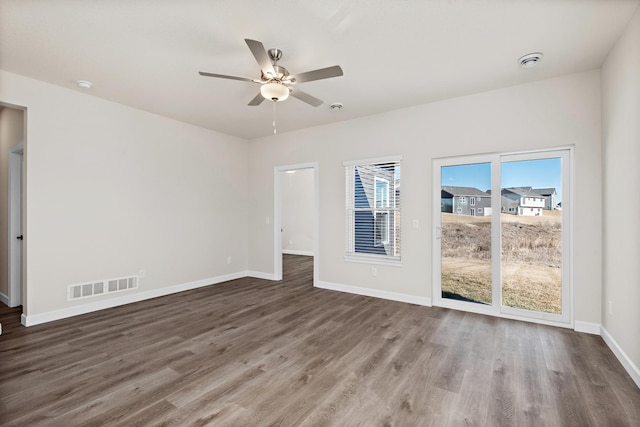 18756 Ivanhoe St NW, Elk River, MN 55330 - spare room featuring a ceiling fan, wood finished floors, and a smoke detector