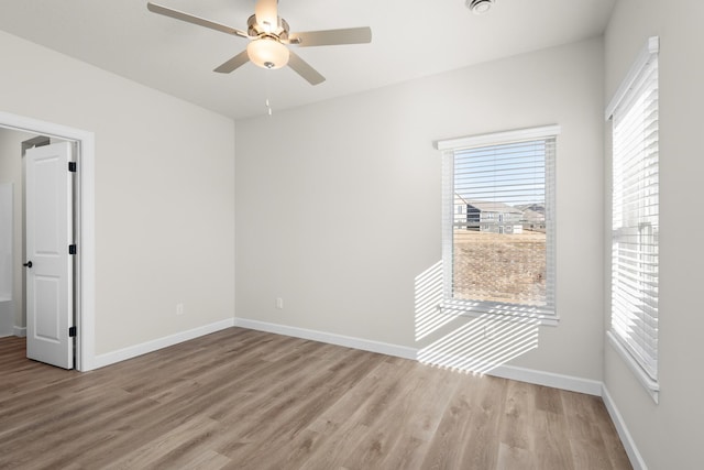 18756 Ivanhoe St NW, Elk River, MN 55330 - empty room featuring light wood-style flooring and a ceiling fan