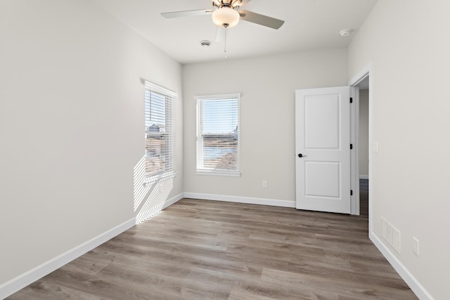 18756 Ivanhoe St NW, Elk River, MN 55330 - spare room featuring ceiling fan, wood finished floors, and a smoke detector