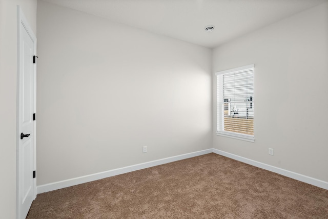 18756 Ivanhoe St NW, Elk River, MN 55330 - spare room featuring carpet floors and baseboards
