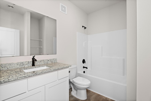 18756 Ivanhoe St NW, Elk River, MN 55330 - bathroom with wood finished floors, vanity, and shower / bathtub combination