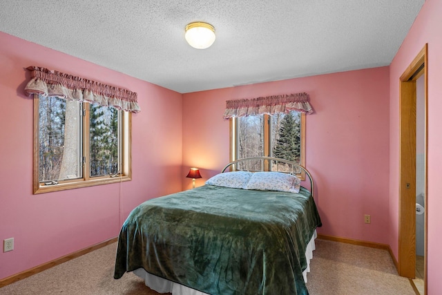 N2641 Cipra Rd, Sarona, WI 54870 - carpeted bedroom with a textured ceiling and baseboards