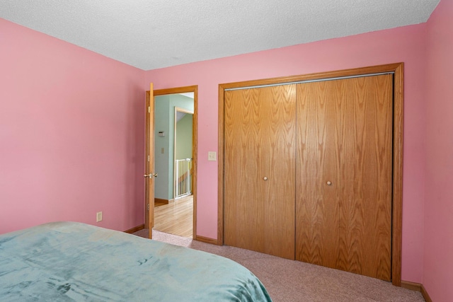 N2641 Cipra Rd, Sarona, WI 54870 - carpeted bedroom with a closet and a textured ceiling