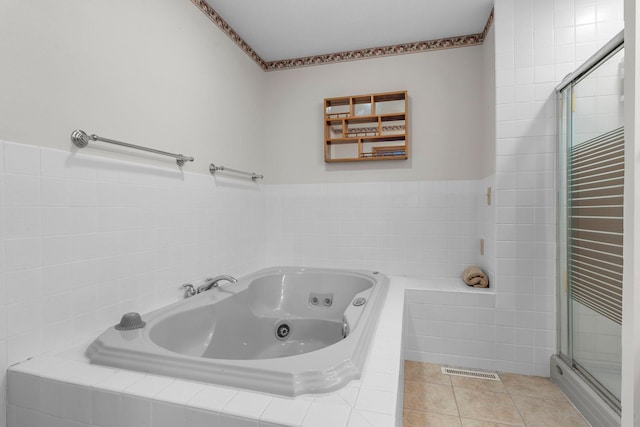 N2641 Cipra Rd, Sarona, WI 54870 - full bath featuring a stall shower, a whirlpool tub, tile patterned floors, and tile walls