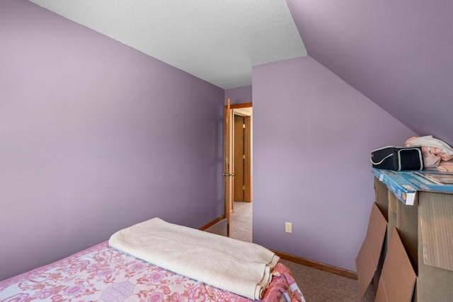 N2641 Cipra Rd, Sarona, WI 54870 - carpeted bedroom featuring vaulted ceiling and baseboards