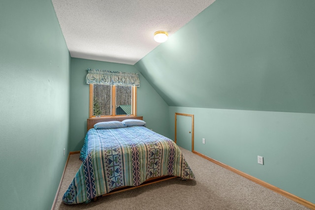 N2641 Cipra Rd, Sarona, WI 54870 - bedroom with carpet flooring, lofted ceiling, and a textured ceiling