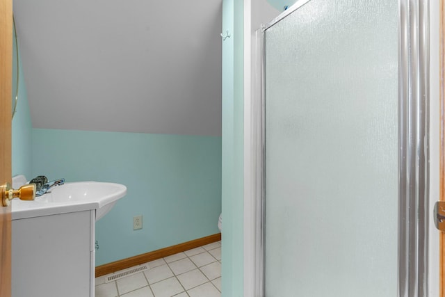 N2641 Cipra Rd, Sarona, WI 54870 - bathroom with a stall shower, vanity, vaulted ceiling, and tile patterned flooring