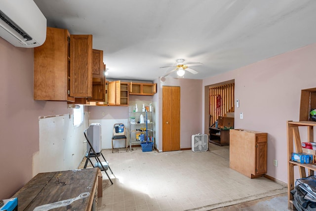 N2641 Cipra Rd, Sarona, WI 54870 - kitchen with a wall mounted air conditioner, open shelves, a ceiling fan, brown cabinets, and light floors
