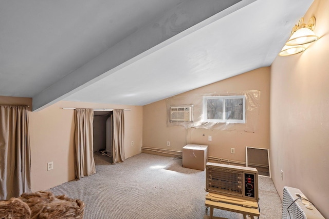 N2641 Cipra Rd, Sarona, WI 54870 - carpeted living room featuring an AC wall unit and lofted ceiling