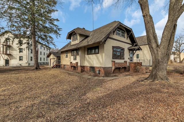 301 7th Ave S, Saint Cloud, MN 56301 - view of front of property with stucco siding and roof with shingles