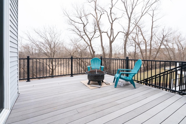 460 14th St NW, New Brighton, MN 55112 - wooden deck featuring an outdoor fire pit