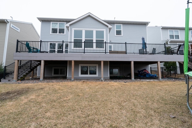460 14th St NW, New Brighton, MN 55112 - back of property with a wooden deck, stairway, and a lawn