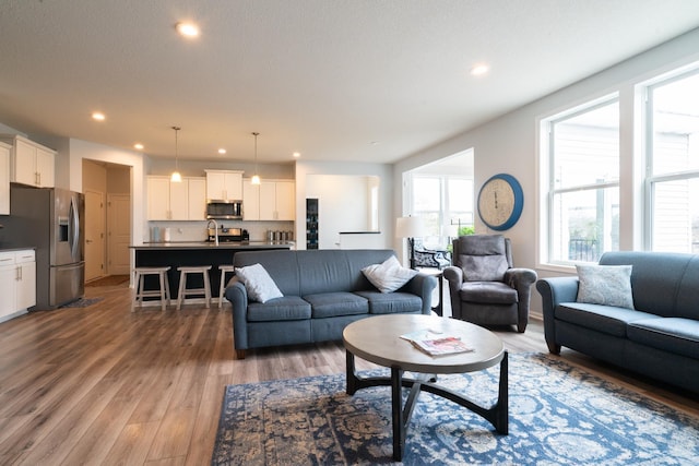 460 14th St NW, New Brighton, MN 55112 - living area with light wood finished floors and recessed lighting