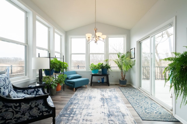 460 14th St NW, New Brighton, MN 55112 - sunroom / solarium with plenty of natural light, a chandelier, lofted ceiling, wood finished floors, and baseboards