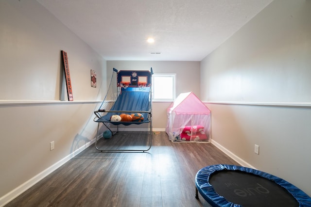 460 14th St NW, New Brighton, MN 55112 - recreation room featuring wood finished floors and baseboards
