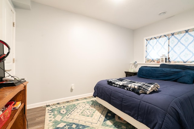 460 14th St NW, New Brighton, MN 55112 - bedroom with baseboards and wood finished floors