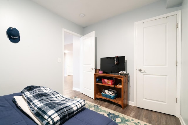 460 14th St NW, New Brighton, MN 55112 - bedroom with wood finished floors and baseboards