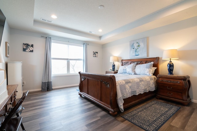 460 14th St NW, New Brighton, MN 55112 - bedroom featuring a raised ceiling, dark wood-style flooring, baseboards, and recessed lighting
