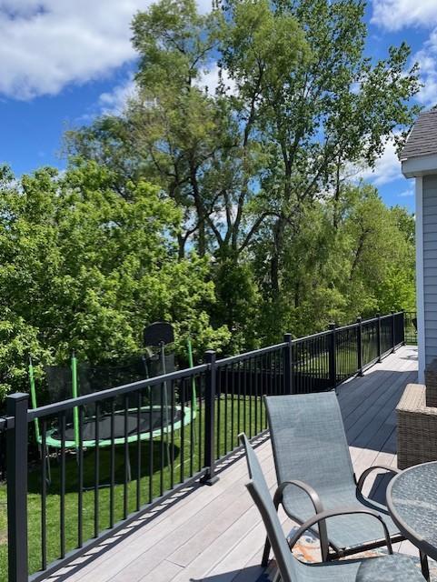 460 14th St NW, New Brighton, MN 55112 - wooden deck with a yard