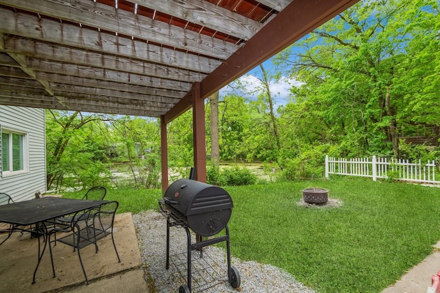 view of patio / terrace featuring an outdoor fire pit, grilling area, a pergola, and outdoor dining area
