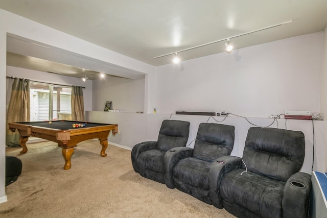carpeted cinema with track lighting, billiards table, and baseboards