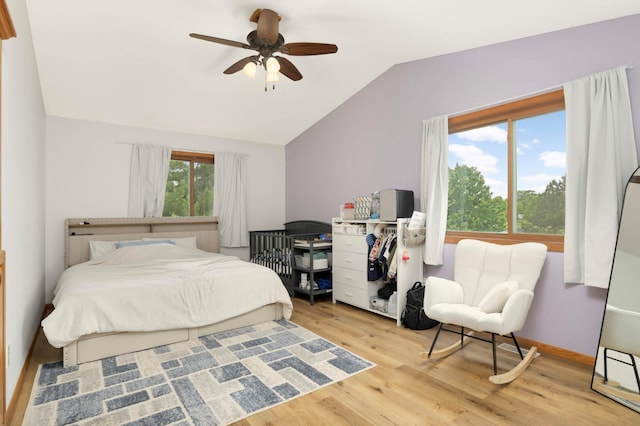 2222 Crosstown Blvd NE, Ham Lake, MN 55304 - bedroom with vaulted ceiling, wood finished floors, and a ceiling fan