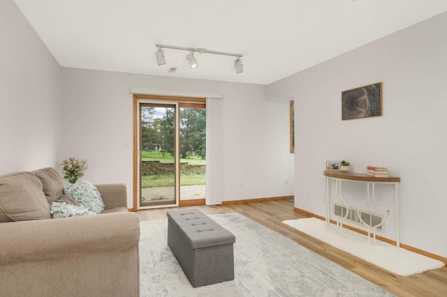 2222 Crosstown Blvd NE, Ham Lake, MN 55304 - living room with wood finished floors, rail lighting, and baseboards