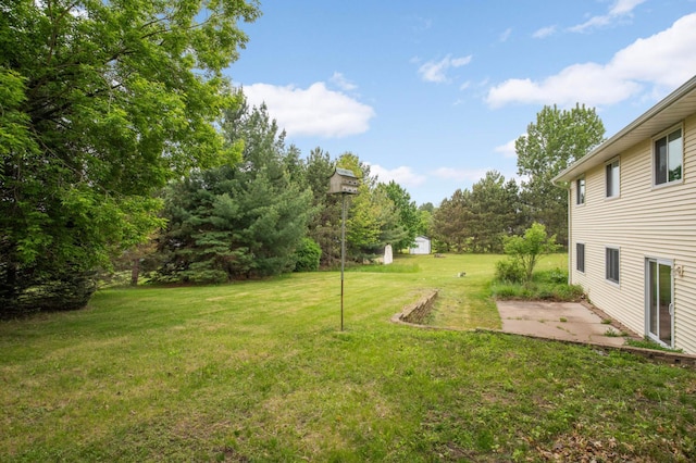 2222 Crosstown Blvd NE, Ham Lake, MN 55304 - view of green lawn featuring a patio area