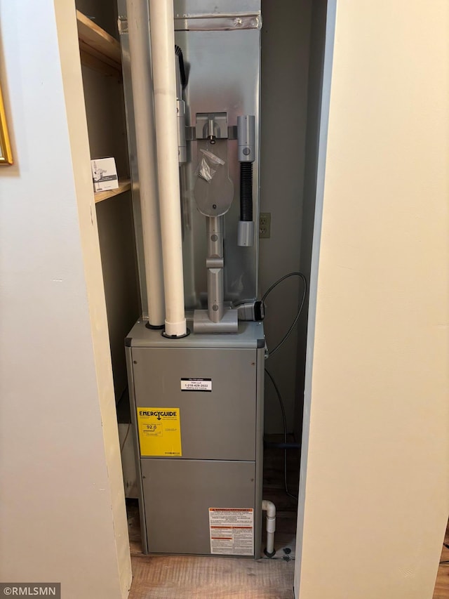 utility room with heating unit
