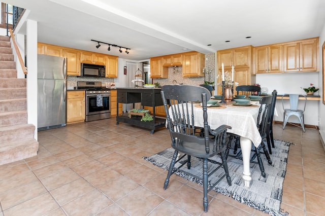 332 Riverside Ave S, Sartell, MN 56377 - dining space featuring stairs, light tile patterned floors, and track lighting