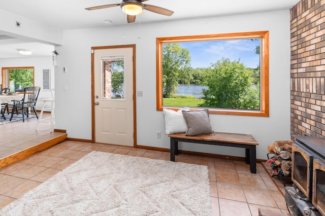 332 Riverside Ave S, Sartell, MN 56377 - foyer entrance featuring ceiling fan, tile patterned flooring, baseboards, and a water view
