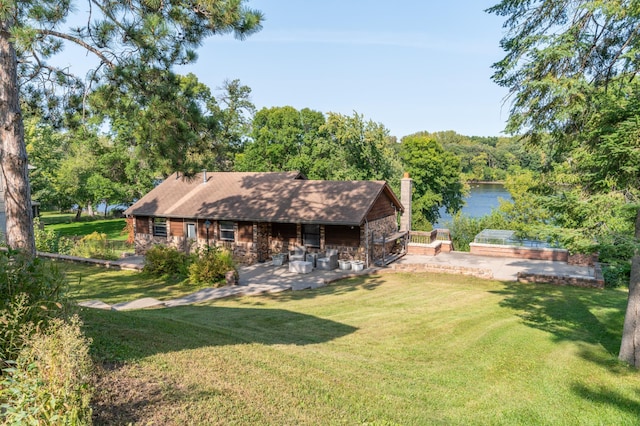 332 Riverside Ave S, Sartell, MN 56377 - back of house with a yard, a water view, a chimney, and a patio area