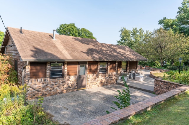 332 Riverside Ave S, Sartell, MN 56377 - view of front of house featuring a patio and a shingled roof