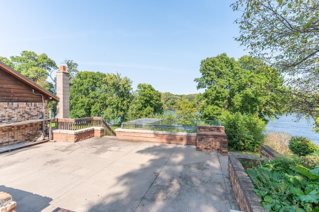 332 Riverside Ave S, Sartell, MN 56377 - view of patio with a water view